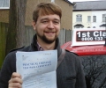 Lukasz with Driving test pass certificate